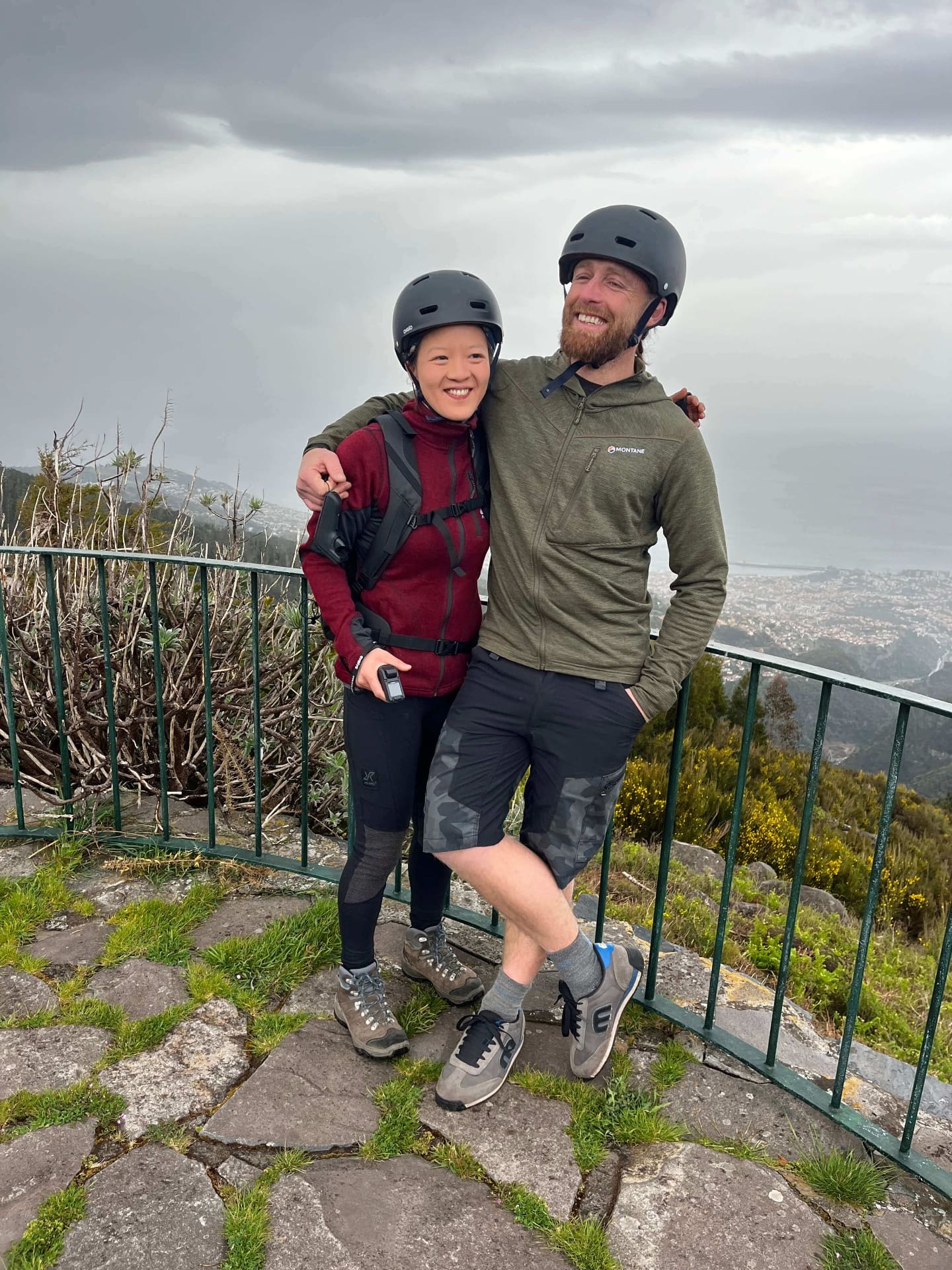 Couple with helmets at Madeira viewpoint after e-board tour