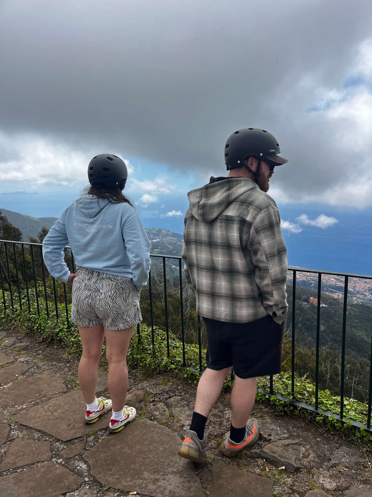 Couple looking out over Funchal valley from a Madeira miradouro