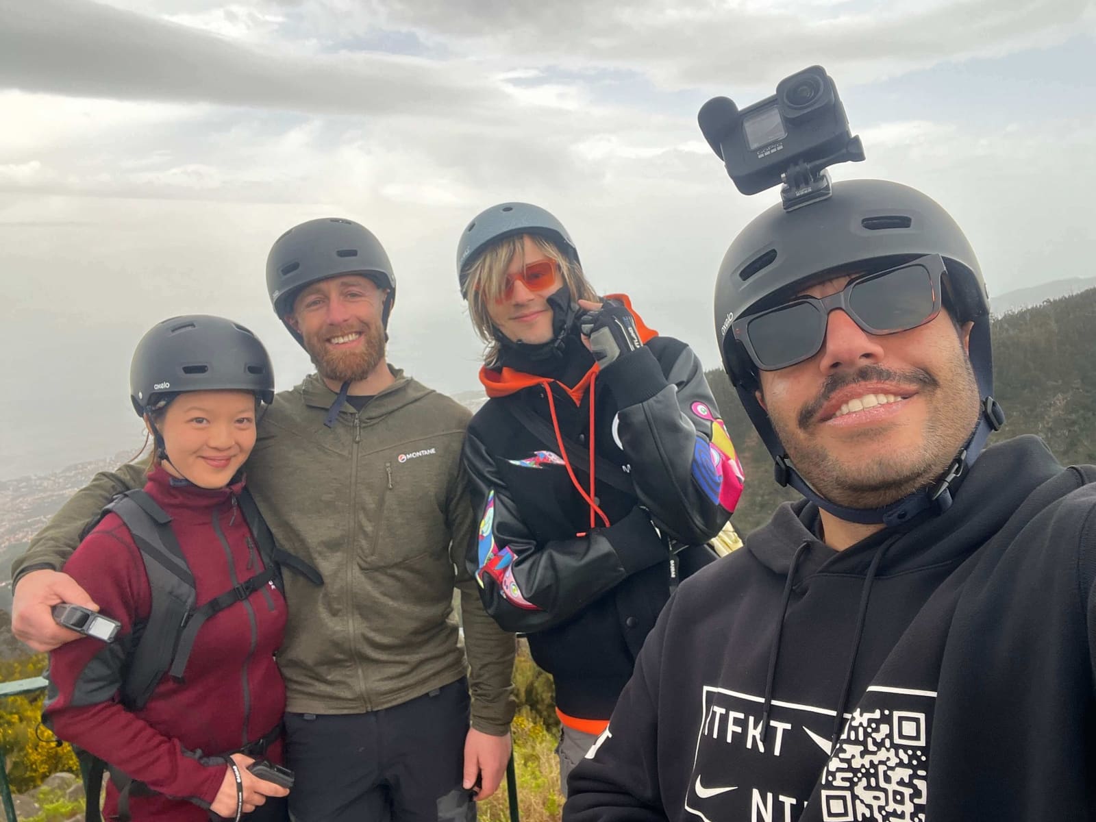 Group selfie with GoPro on top of Madeira mountain after e-board adventure