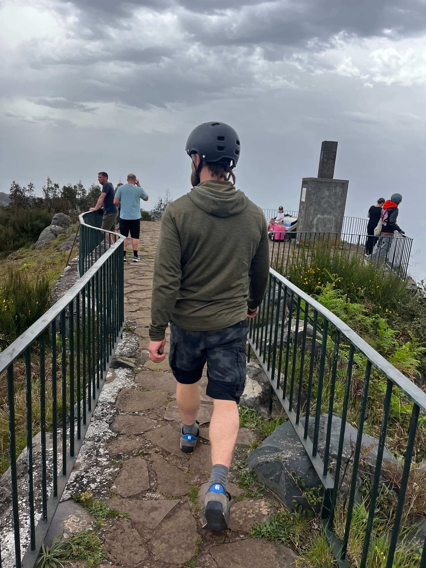 Rider walking towards Madeira miradouro during e-board tour